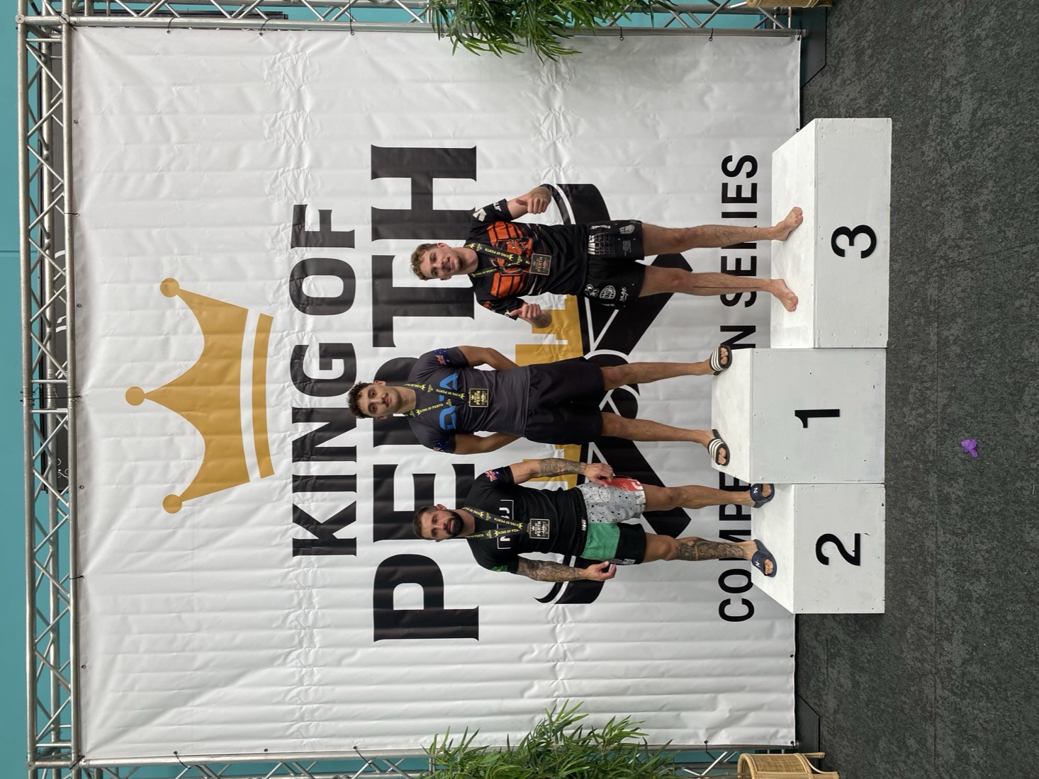 A DCA competitor on the top step of the King of Perth podium
